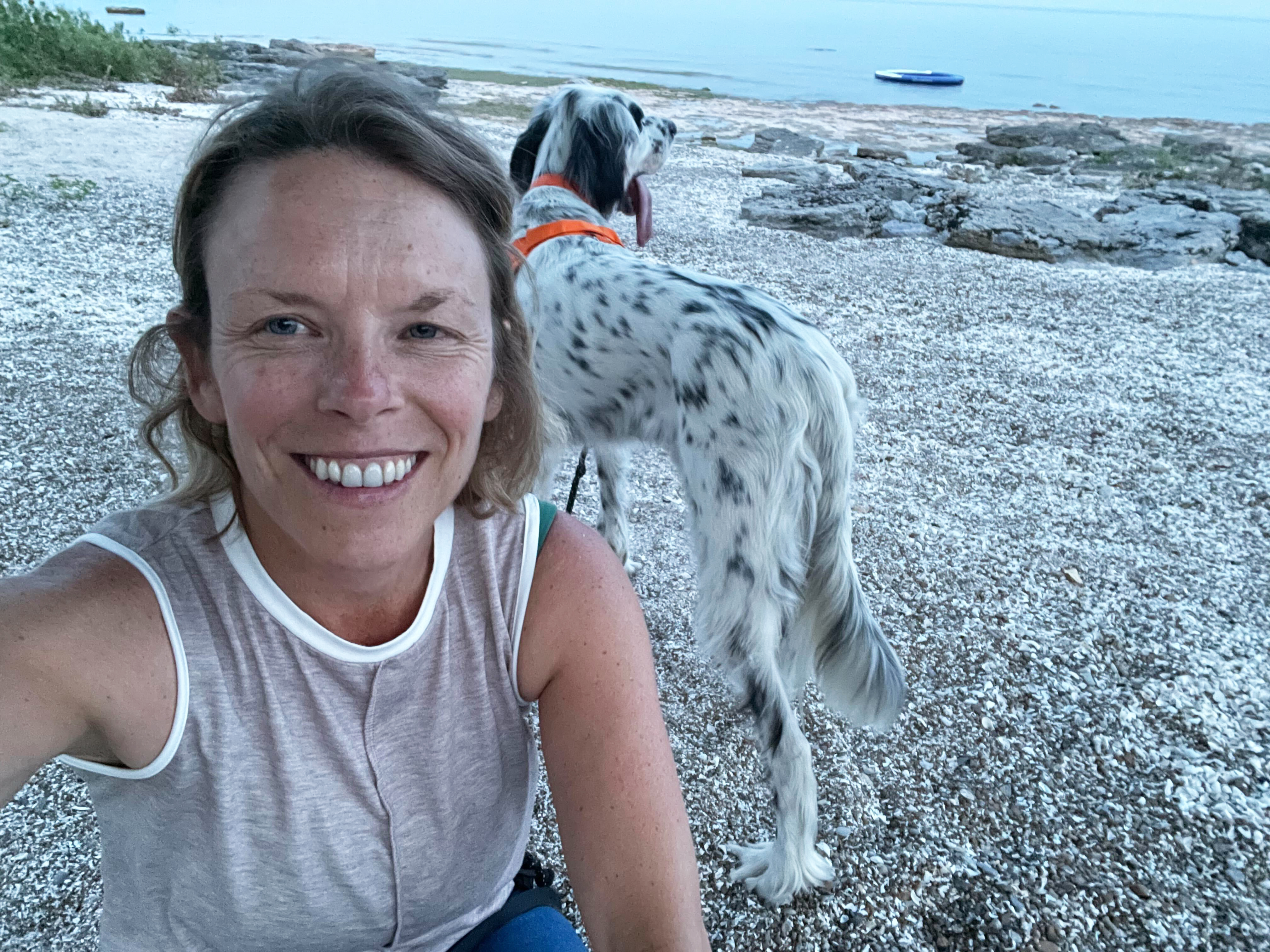 Katherine Balpataky and Crowley, the English Setter, exploring the shores of Lake Erie.