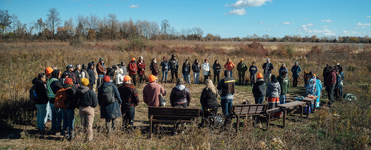 Full group participating in the first water ceremony held at a Caldwell First Nation wetland restoration site as part of the IPBES workshop in Windsor. 